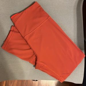 Athleta Salutation 7/8 Tight Rust/Orange Laser Cut Leggings - Medium